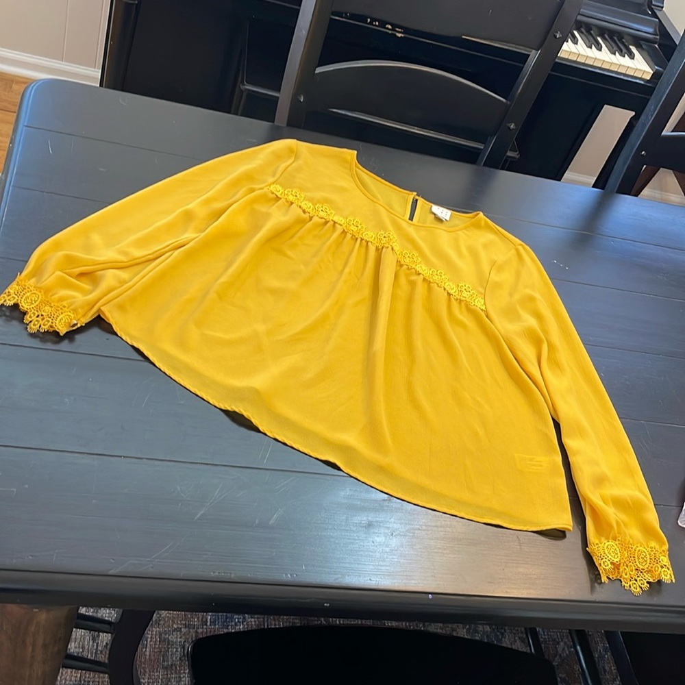 A New Day golden blouse with lace across chest and sleeves; small
